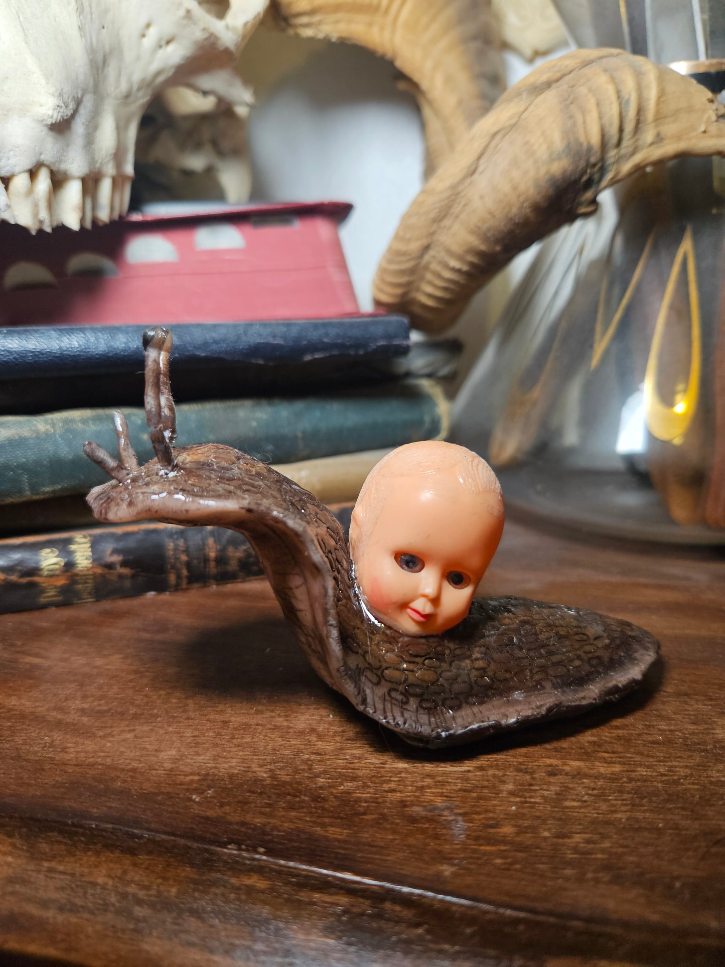Mini babyhead snail sculpture