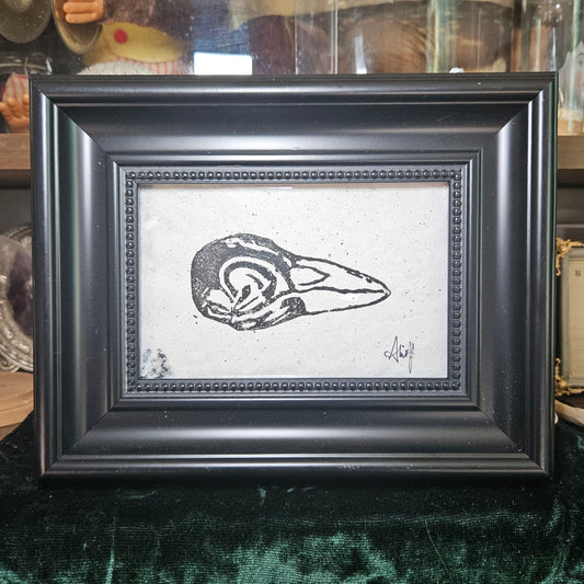 Raven skull linocut