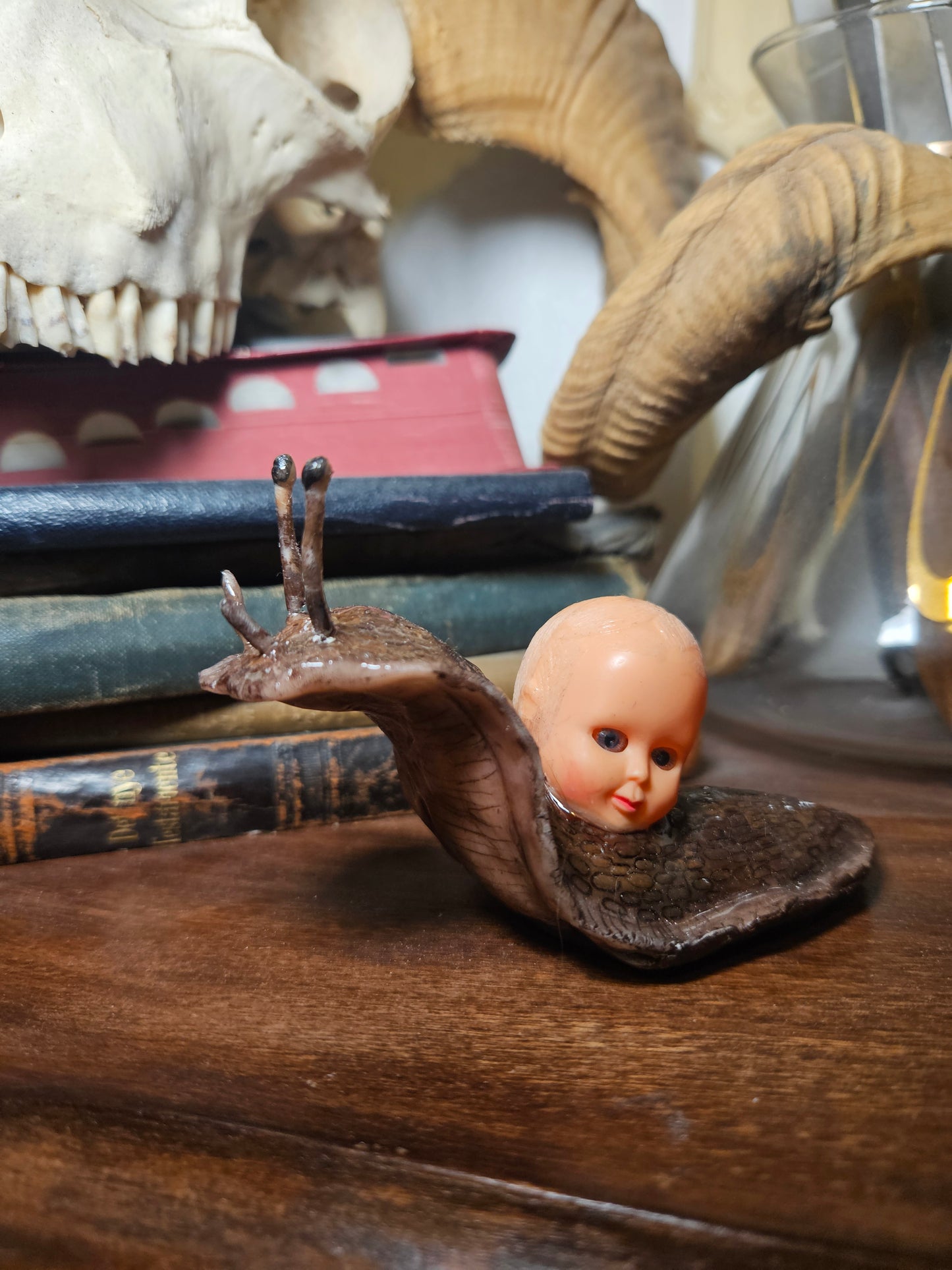 Mini babyhead snail sculpture